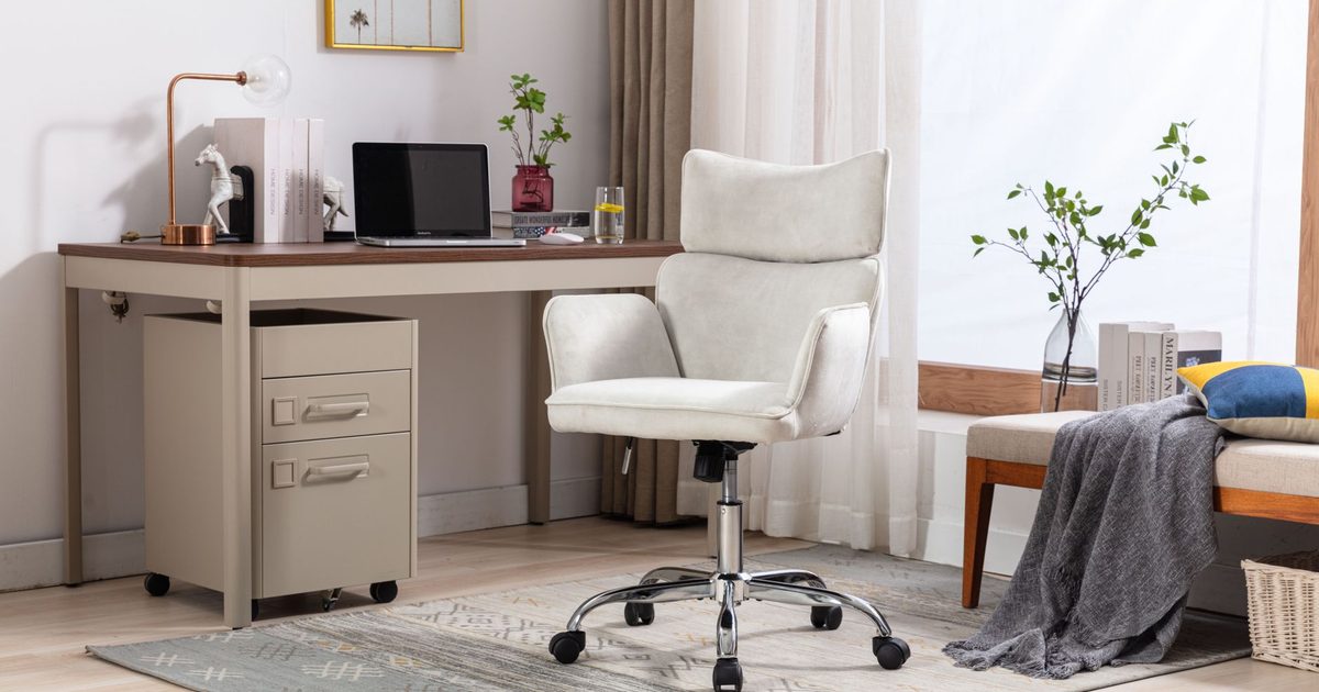 a cream office chair with padded armrests beside a home office desk