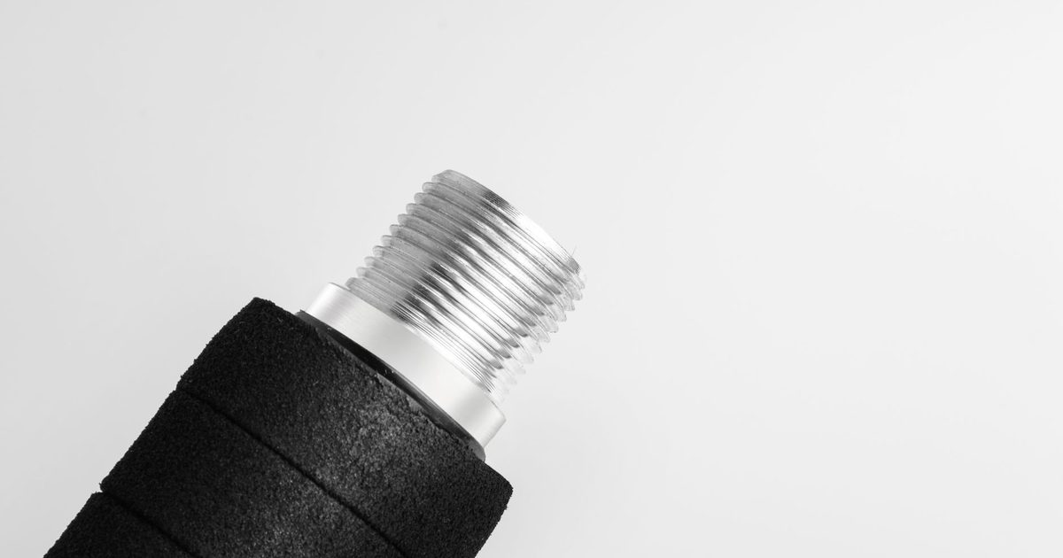close-up of a chrome and black office chair gas lift cylinder